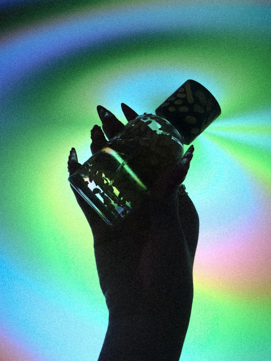 A bottle held up against the screen