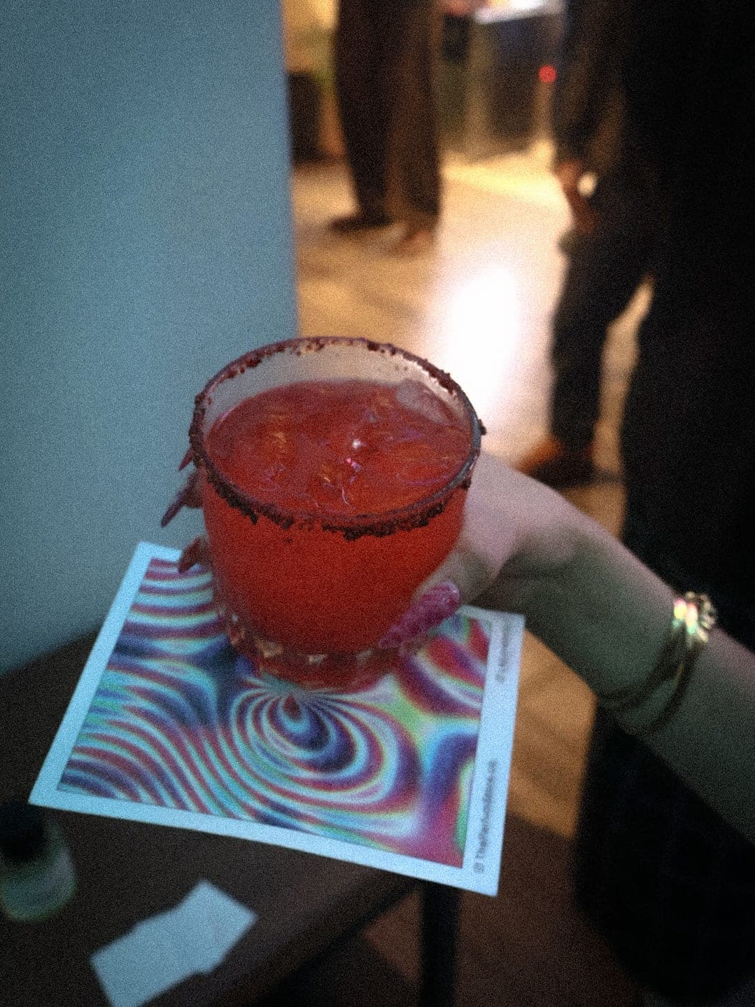 A drink over a card